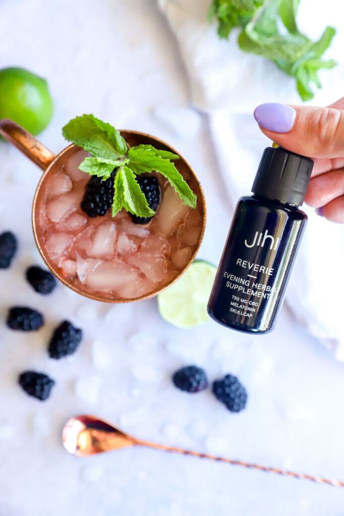 Non-alcoholic blackberry mule with ginger beer and lime