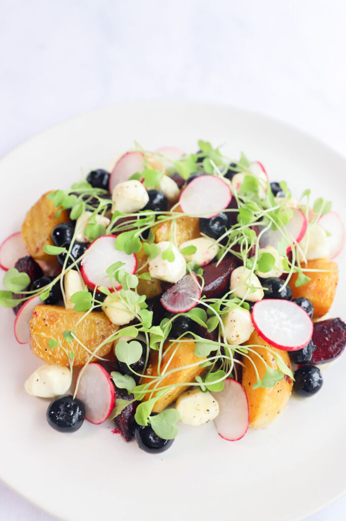 Roasted beet salad with blueberries and a drizzle of dressing