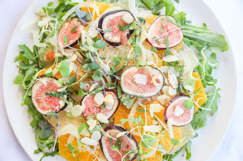 Citrus salad with fresh microgreens and a variety of citrus fruits