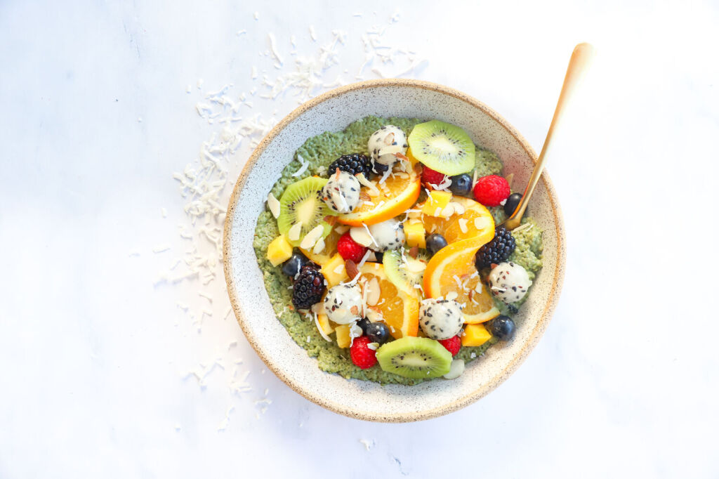 Coconut chia seed pudding bowl with mango and kiwi slices