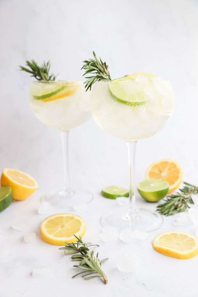 Refreshing rosemary elderflower spritz mocktail with fresh rosemary