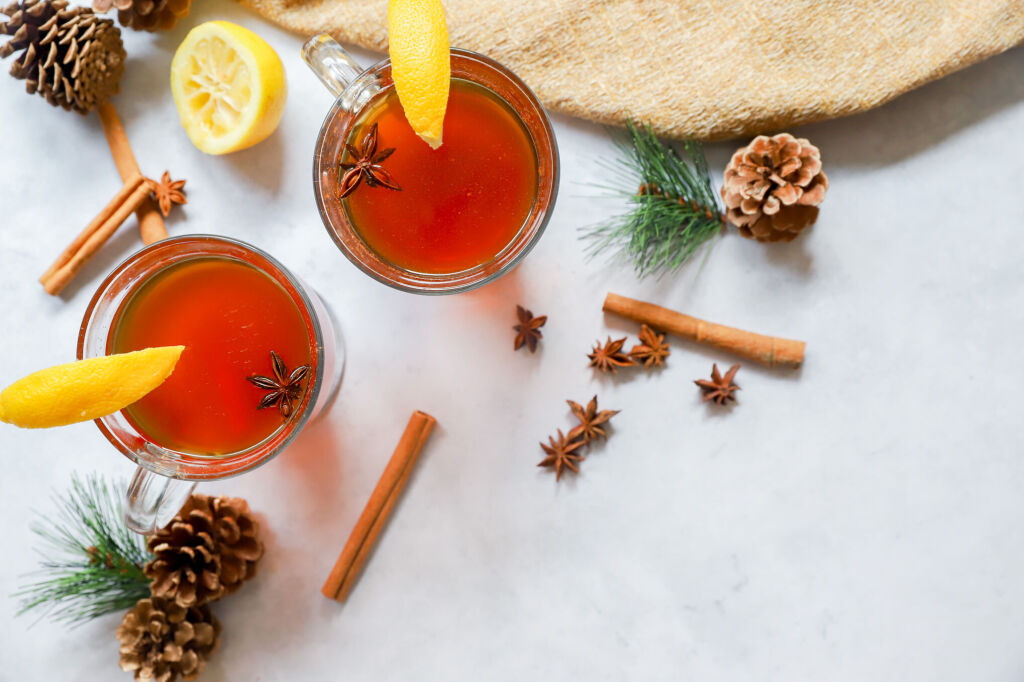 Virgin hot toddy with lemon wedge, honey, and star anise