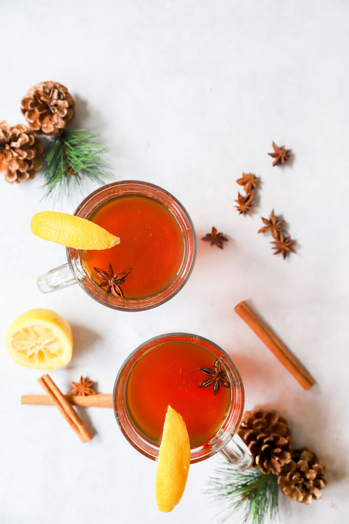 Warm virgin hot toddy with honey, lemon, and a star anise garnish