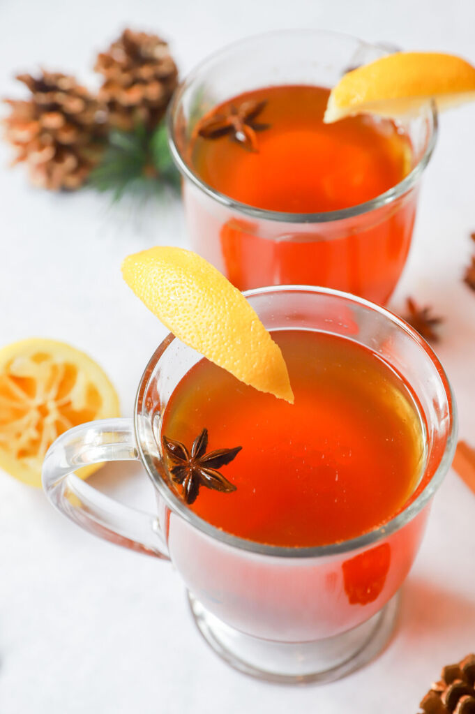 Family-friendly virgin hot toddy in a mug with fresh lemon juice and honey