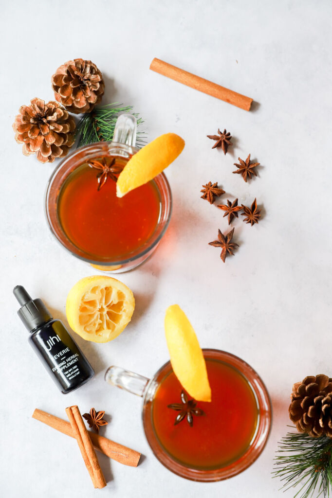 Warm virgin hot toddy with honey, lemon, and a star anise garnish