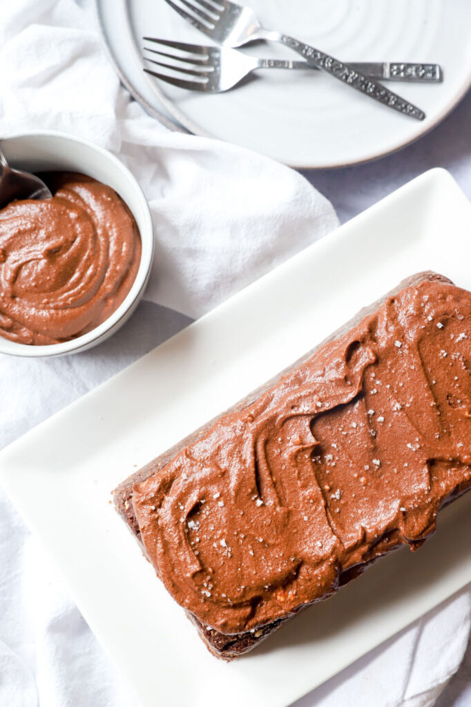 Gluten-free no-bake Nutella cake topped with hazelnuts