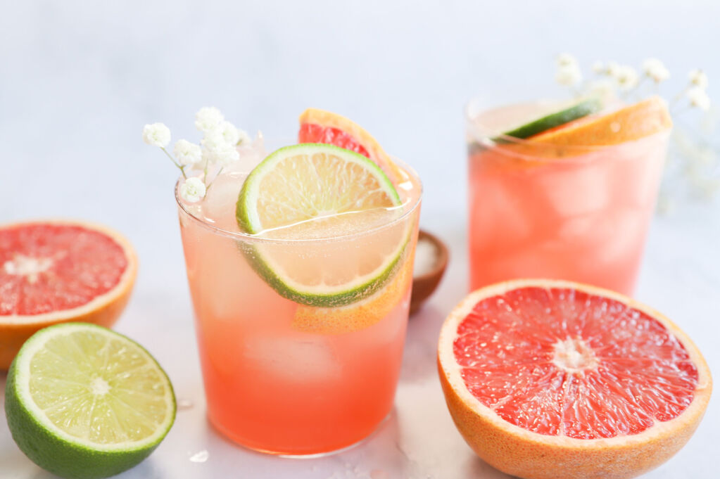 Refreshing Paloma mocktail with grapefruit and citrus garnishes