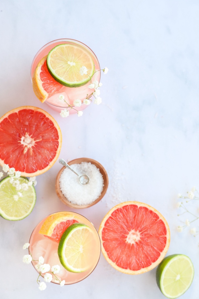 Citrus Paloma mocktail served in a glass with grapefruit and lime