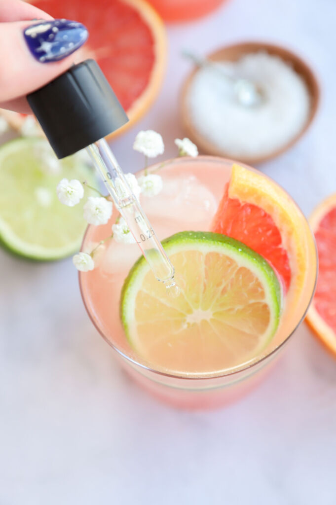 Citrus Paloma mocktail served in a glass with grapefruit and lime