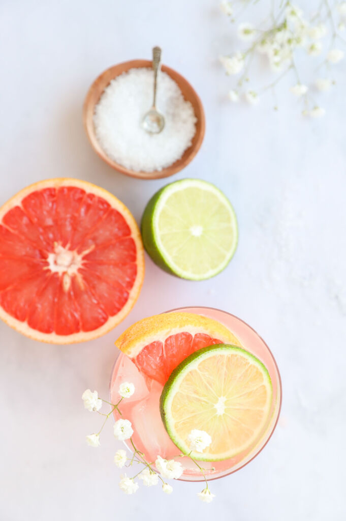 Citrus Paloma mocktail served in a glass with grapefruit and lime