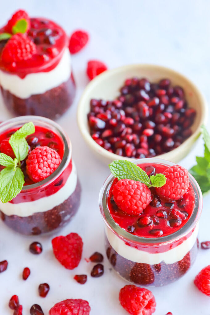 Pomegranate chia seed pudding parfait layered with yogurt and fresh pomegranate seeds