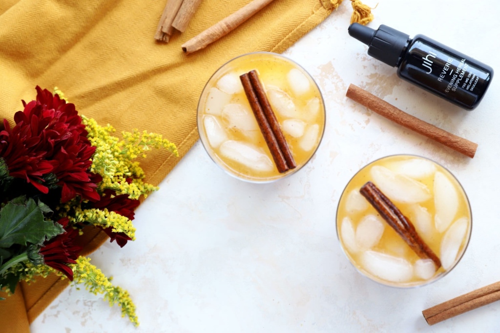 Pumpkin spice mocktail with a cinnamon stick garnish