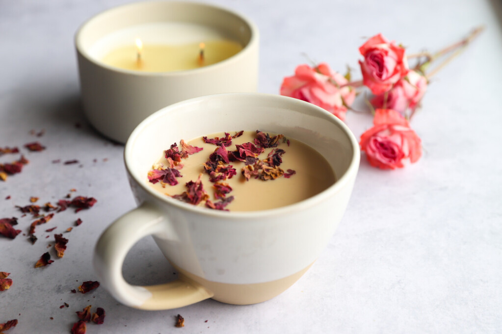 Cup of Rose Petal Milk Tea with a spoon and rose petals