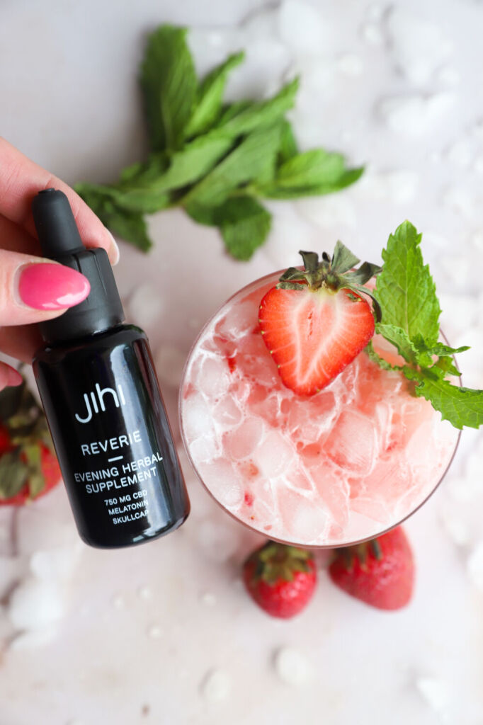 Refreshing strawberry kombucha drink with lime and strawberries