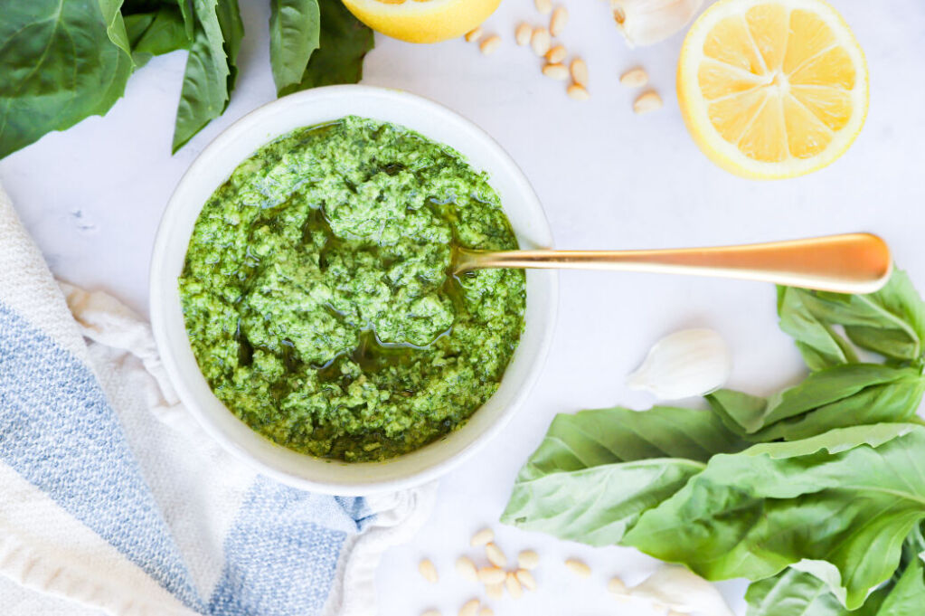 Fresh basil pesto sauce with pine nuts on a plate