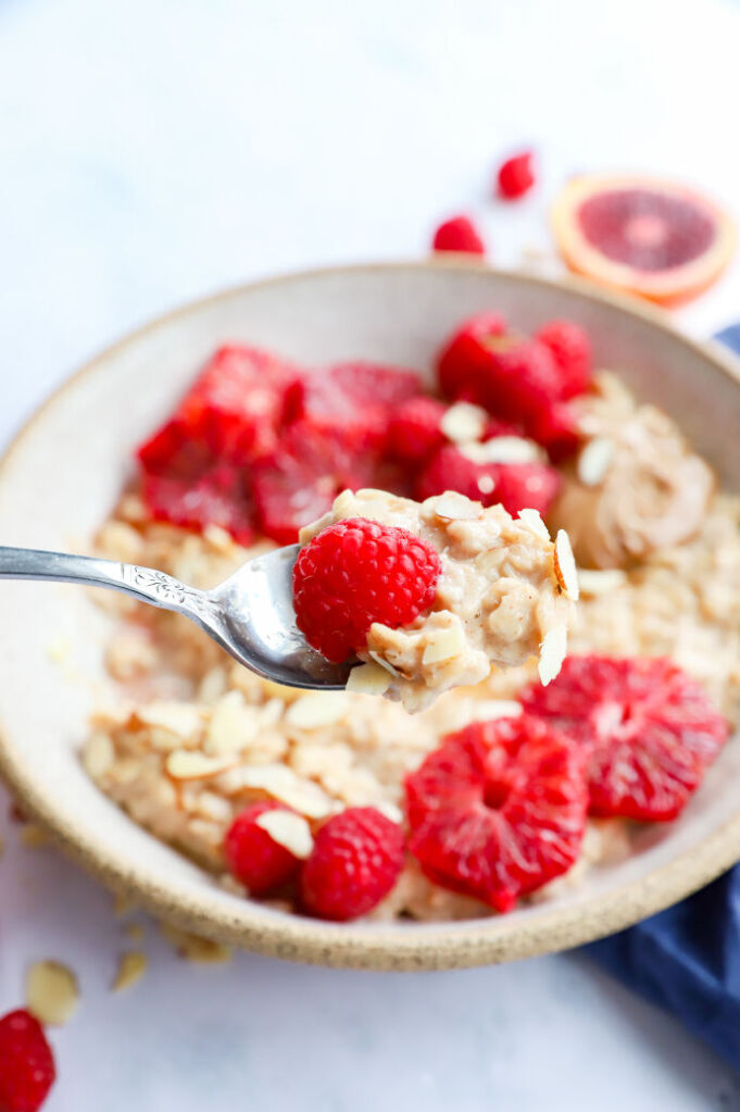 Hormonal health oatmeal with blood oranges, fresh raspberries, and almond butter