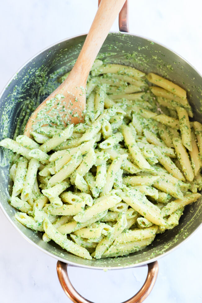 Creamy basil pesto pasta with pine nuts in a bowl