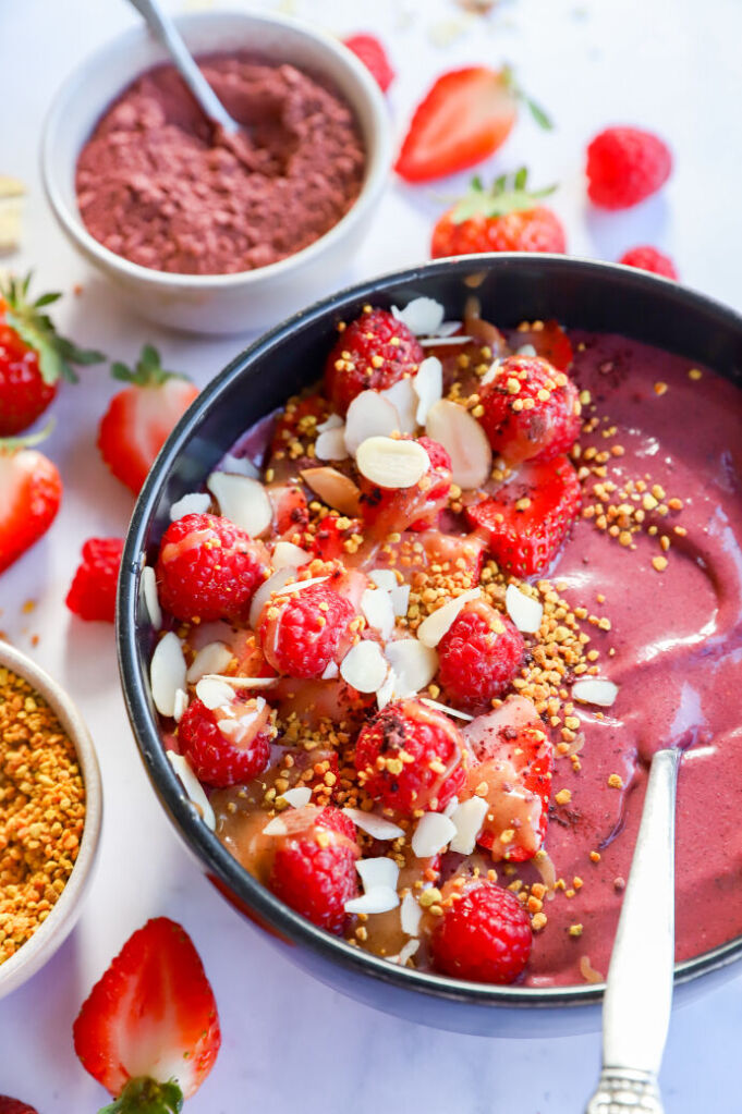 Hibiscus smoothie bowl with berry banana, chia seeds, and almond butter