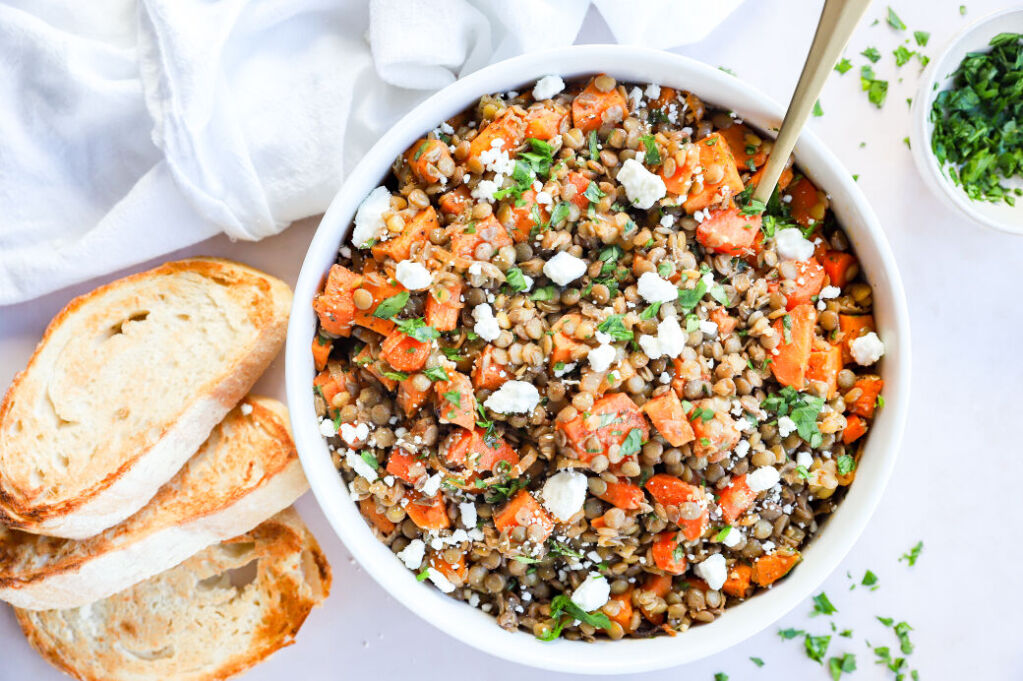 Lentil salad with goat cheese and sweet potatoes in a bowl