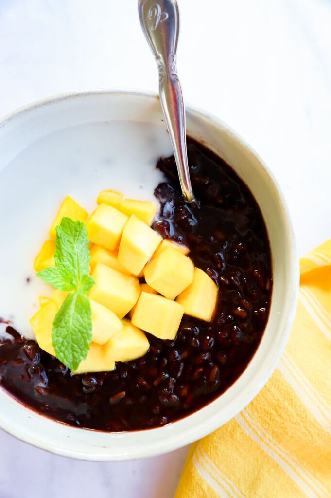 Thai sticky black rice pudding with mango and coconut milk