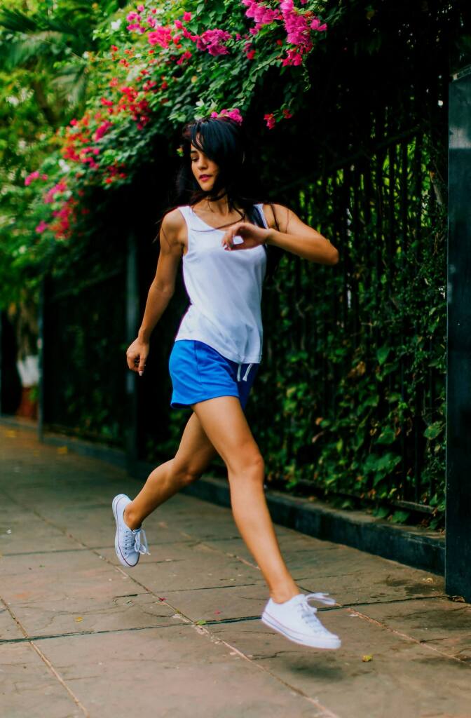 Athletic woman running in the city