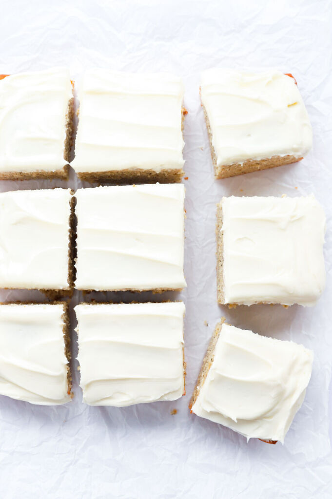 Gluten-free banana cake with cream cheese frosting and sliced bananas