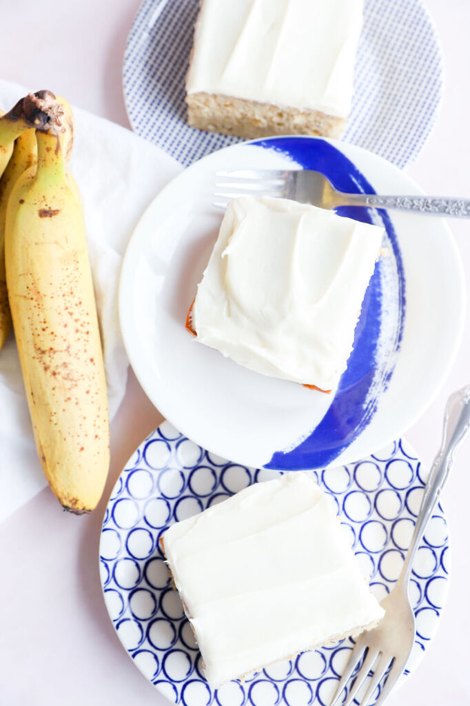 Gluten-free banana cake with cream cheese frosting and sliced bananas