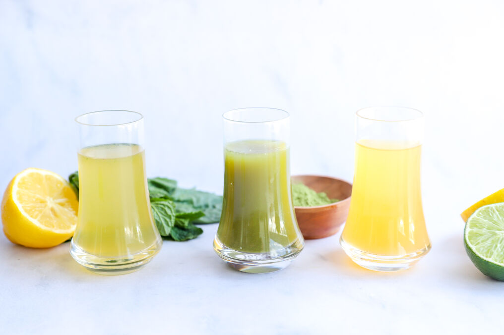 Three green tea shots: non-alcoholic, matcha, and mint, each garnished differently