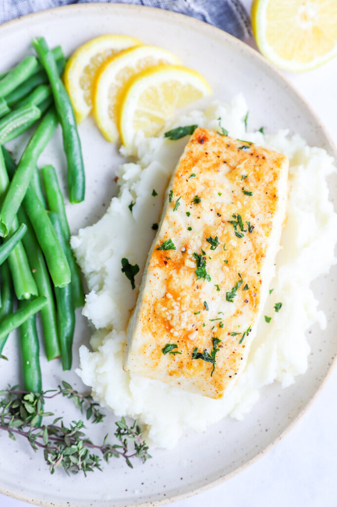 Fresh halibut filets cooked in an air fryer with lemon butter sauce