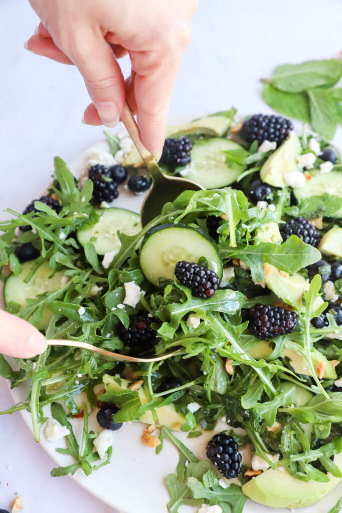 Blackberry, Avocado, and Arugula Salad in a white bowl for hormone balance and anti-inflammatory diets