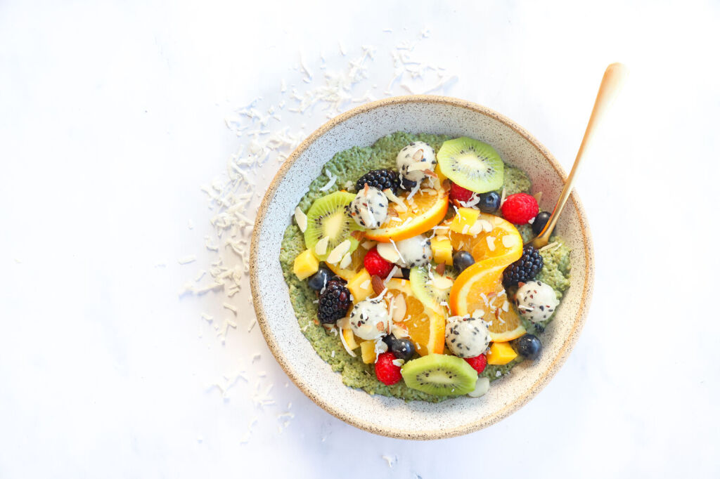 Tropical chia seed pudding bowl topped with blueberries and raspberries