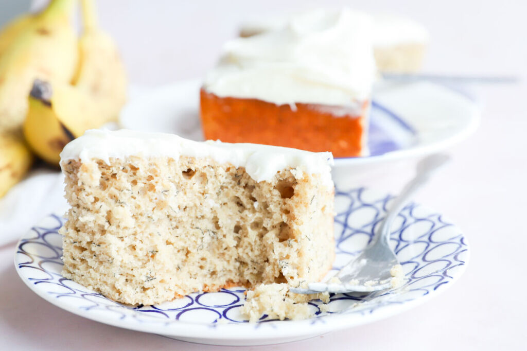 Gluten-free banana cake with cream cheese frosting and sliced bananas