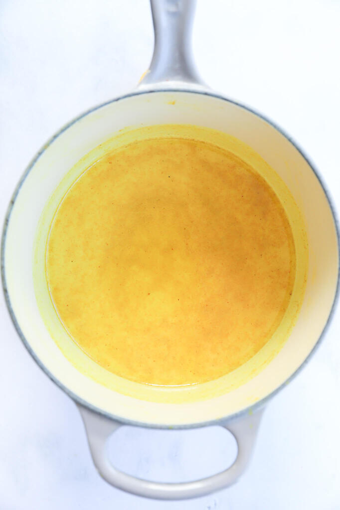 Close-up of Golden Moon Milk with turmeric powder and ginger