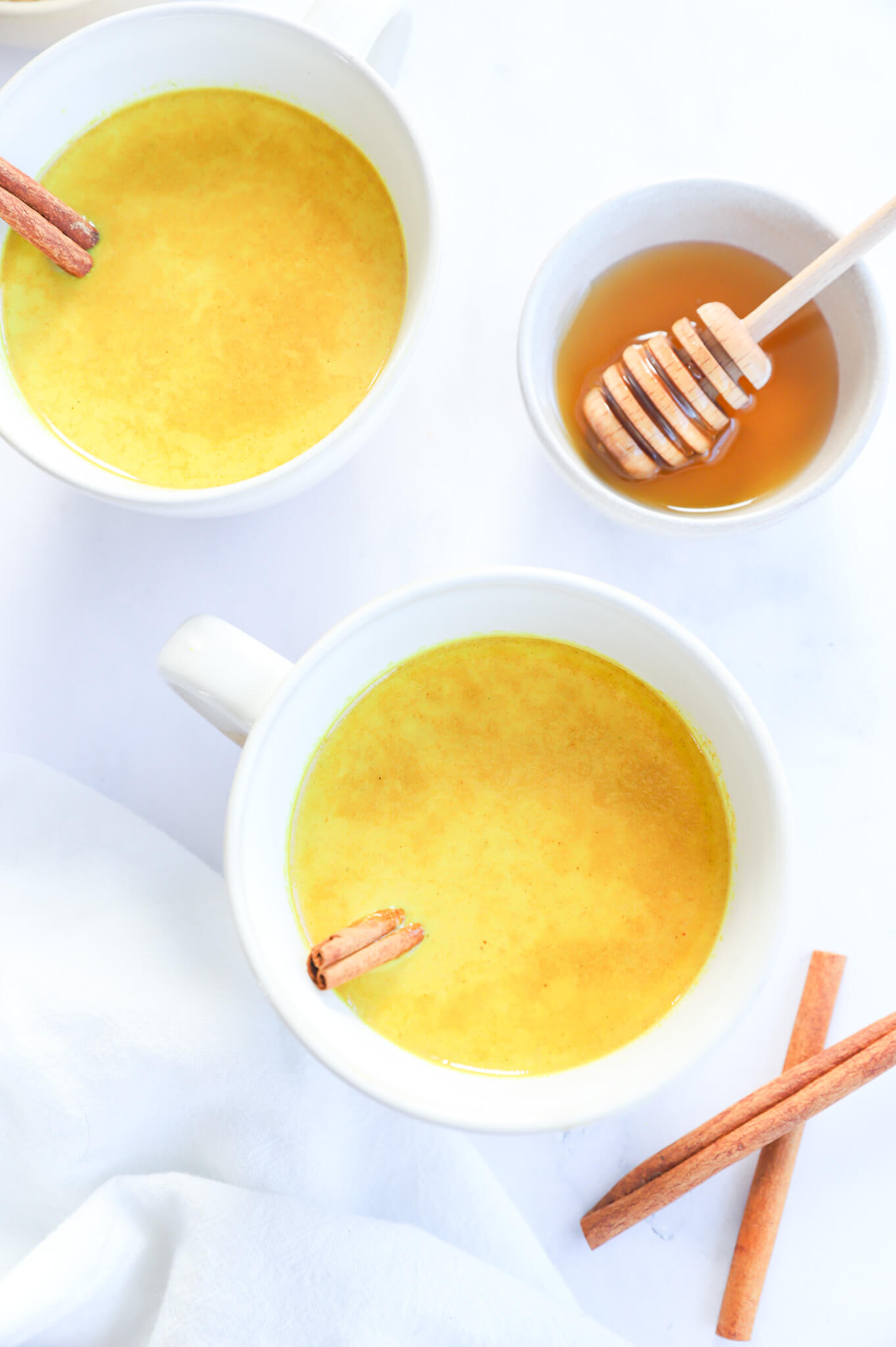 A cup of Golden Moon Milk with turmeric and ginger