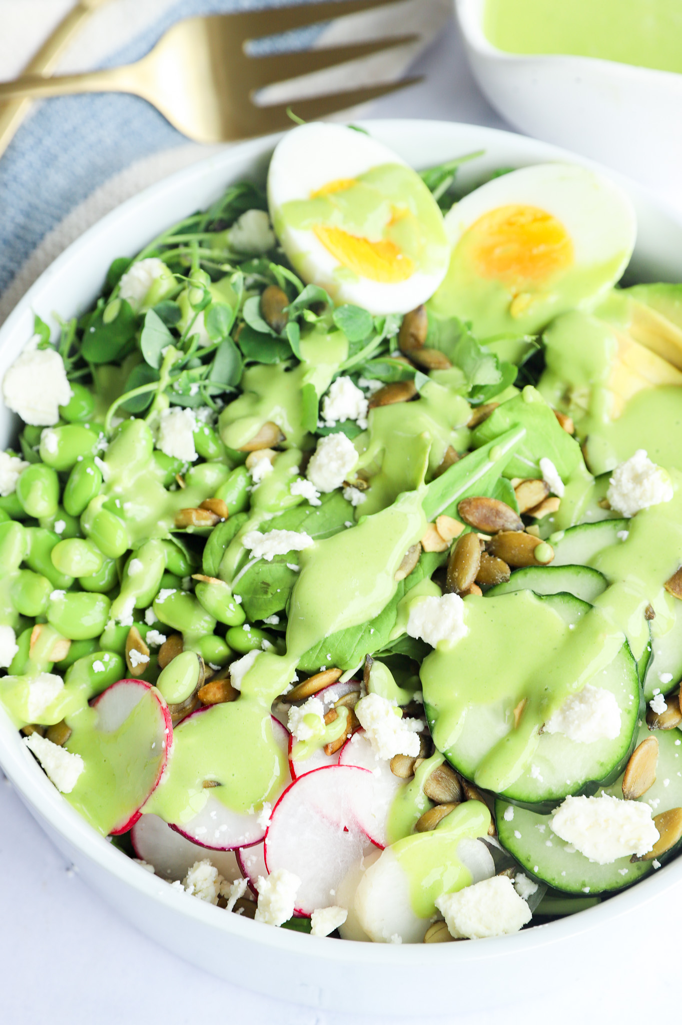 Portrait image of Green Goddess Salad with Avocado and Microgreens