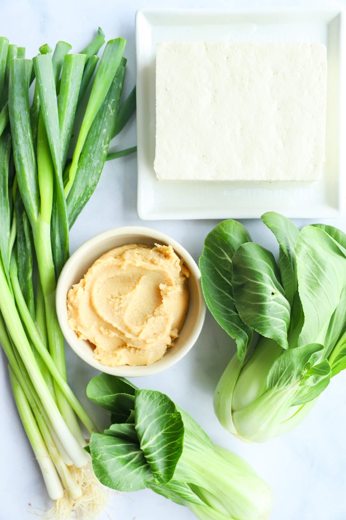 Gourmet presentation of baked miso tofu with bok choy for hormone health