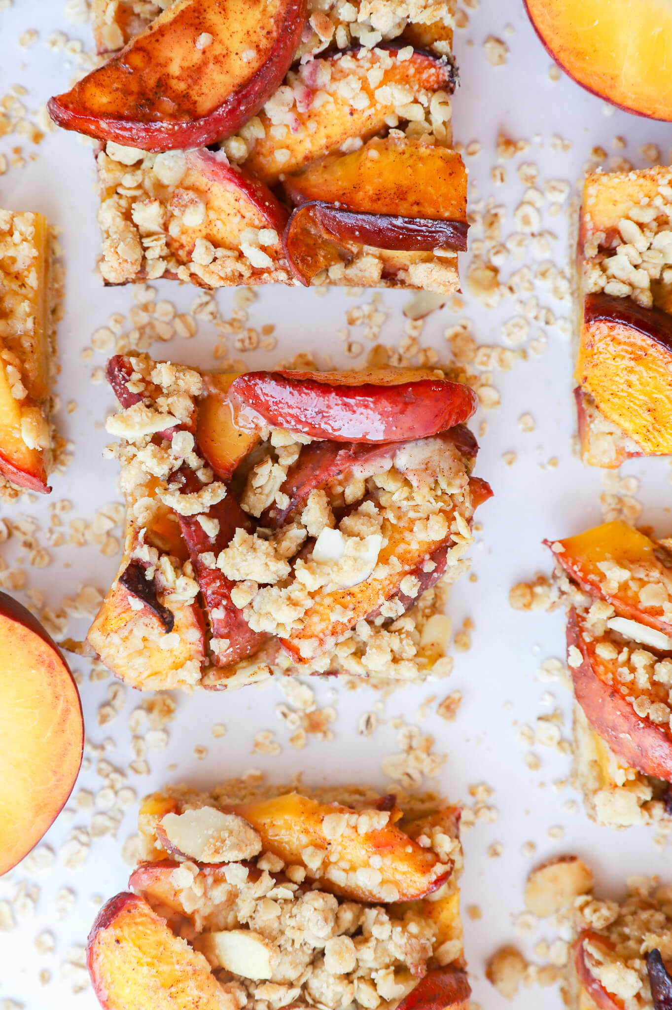 Gluten-free oat bars with peaches and almonds on a plate