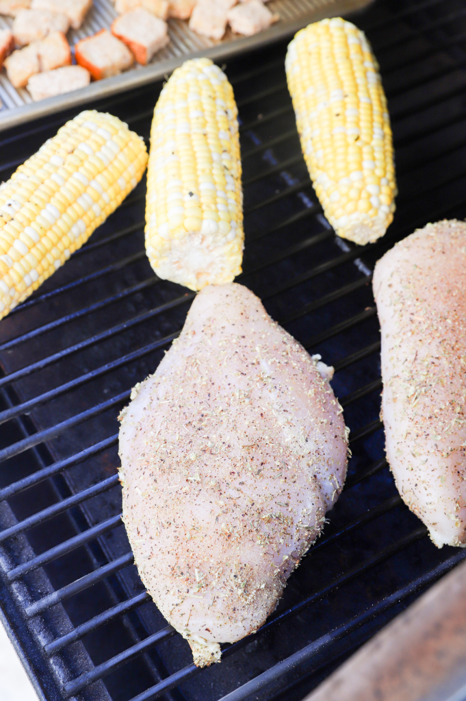 Portrait image of the preparation process for Rustic Avocado and Corn Salad with Caprese Chicken