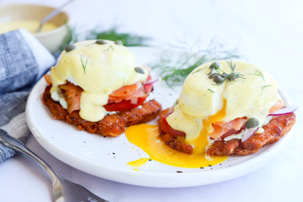 Nourishing smoked salmon eggs benedict on hashbrowns with poached eggs and hollandaise