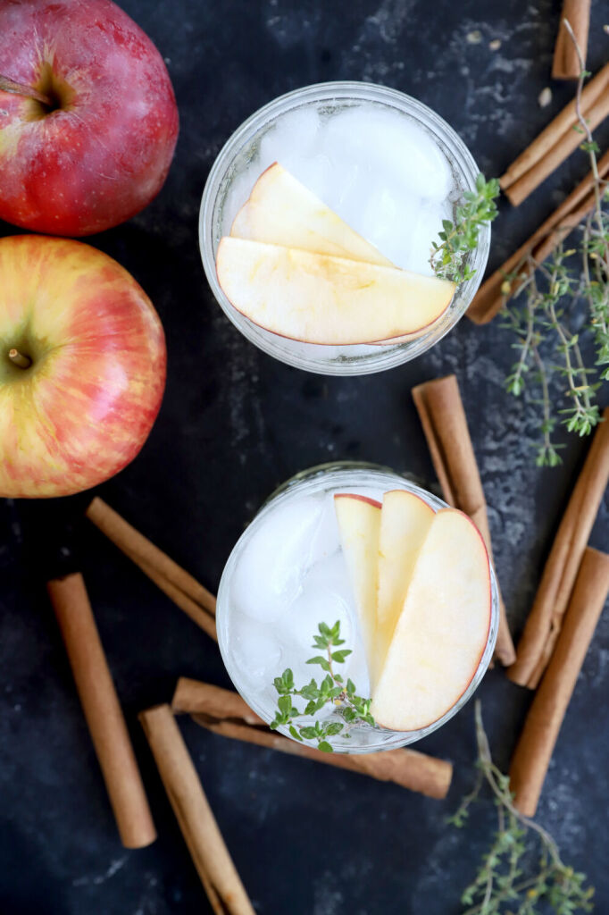 Easy apple cinnamon mocktail in a glass with apple slices