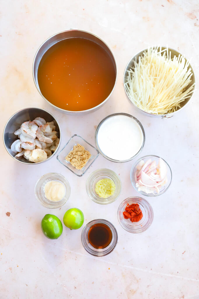 Refreshing Thai coconut curry soup with rice noodles and vibrant vegetables