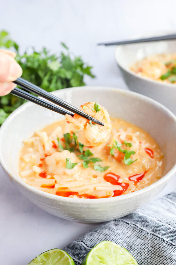 Detoxifying Thai coconut curry soup with rice noodles, lemongrass, and ginger