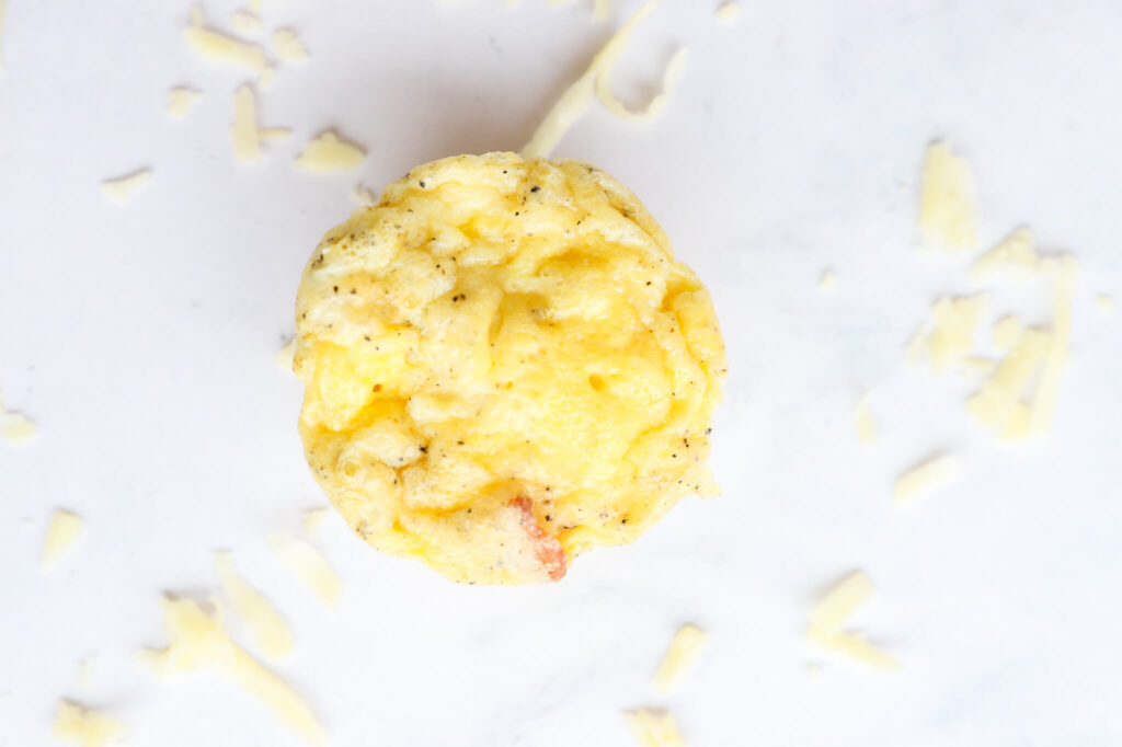 Bacon and Gruyere egg bites arranged on a serving plate