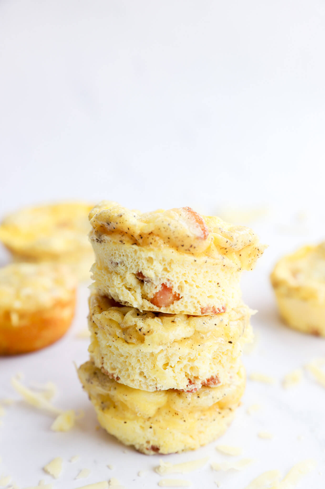 Bacon and Gruyere egg bites on a white plate