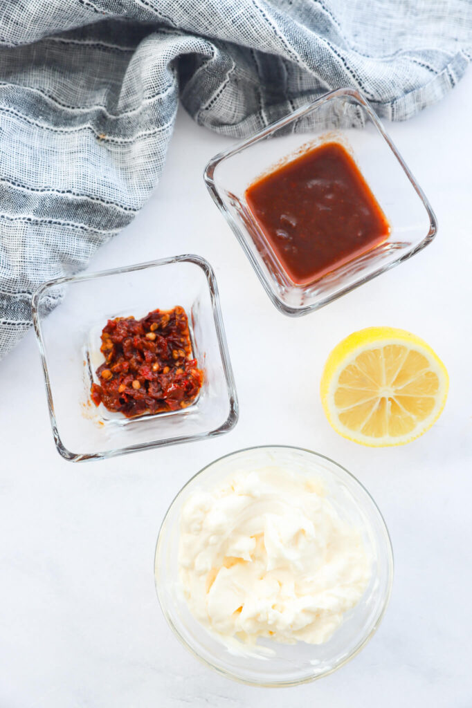 Ingredients for chipotle Greek yogurt sauce, including Greek yogurt, chipotle peppers, and lime.