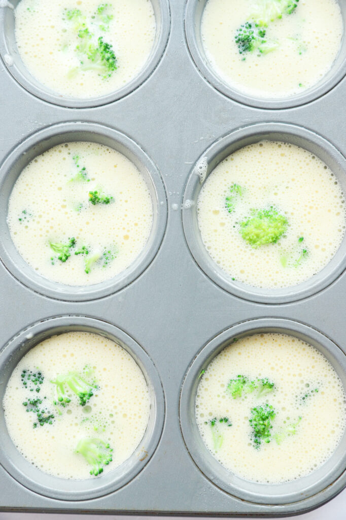 Close-up of broccoli egg bites with cottage cheese on a white plate