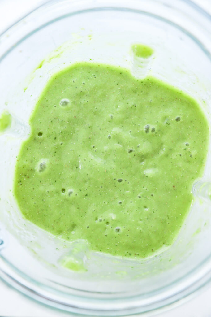 Process shot of blending cucumber, mint, and matcha powder for smoothie