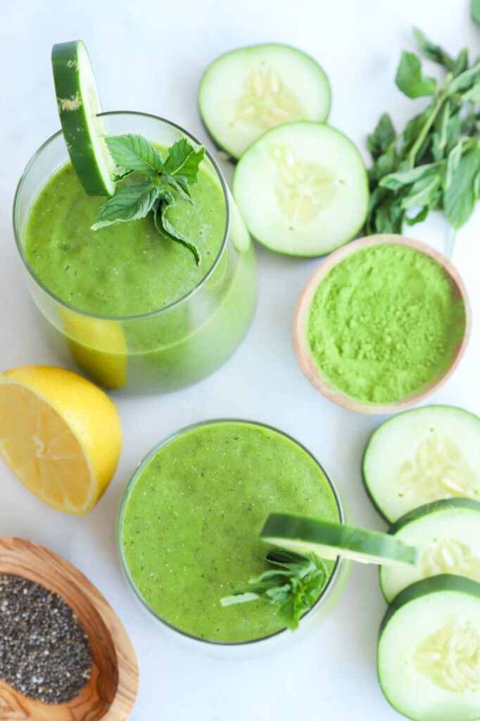 Close-up of cucumber mint matcha smoothie in a glass with mint garnish